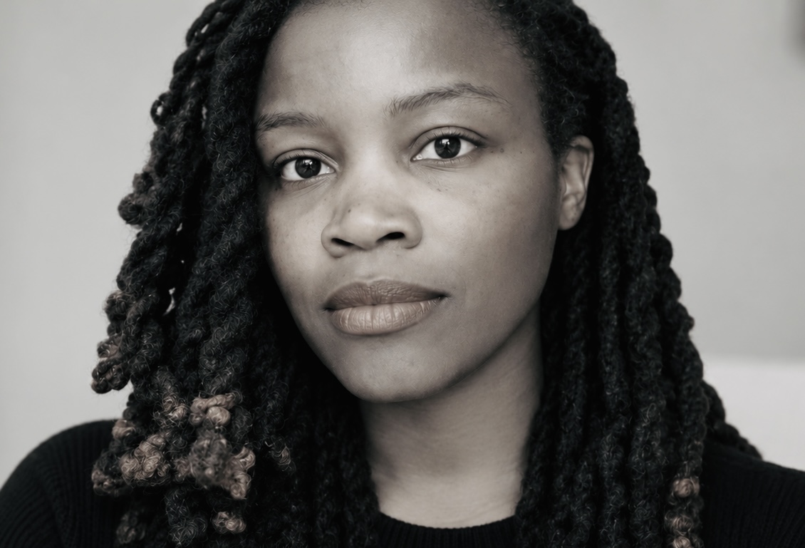 Black-and-white portrait of Aisha Wells
